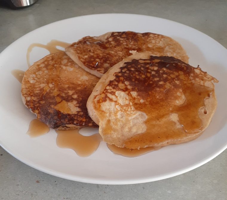 Finished Whole Wheat Pancakes with Maple Syrup on plate